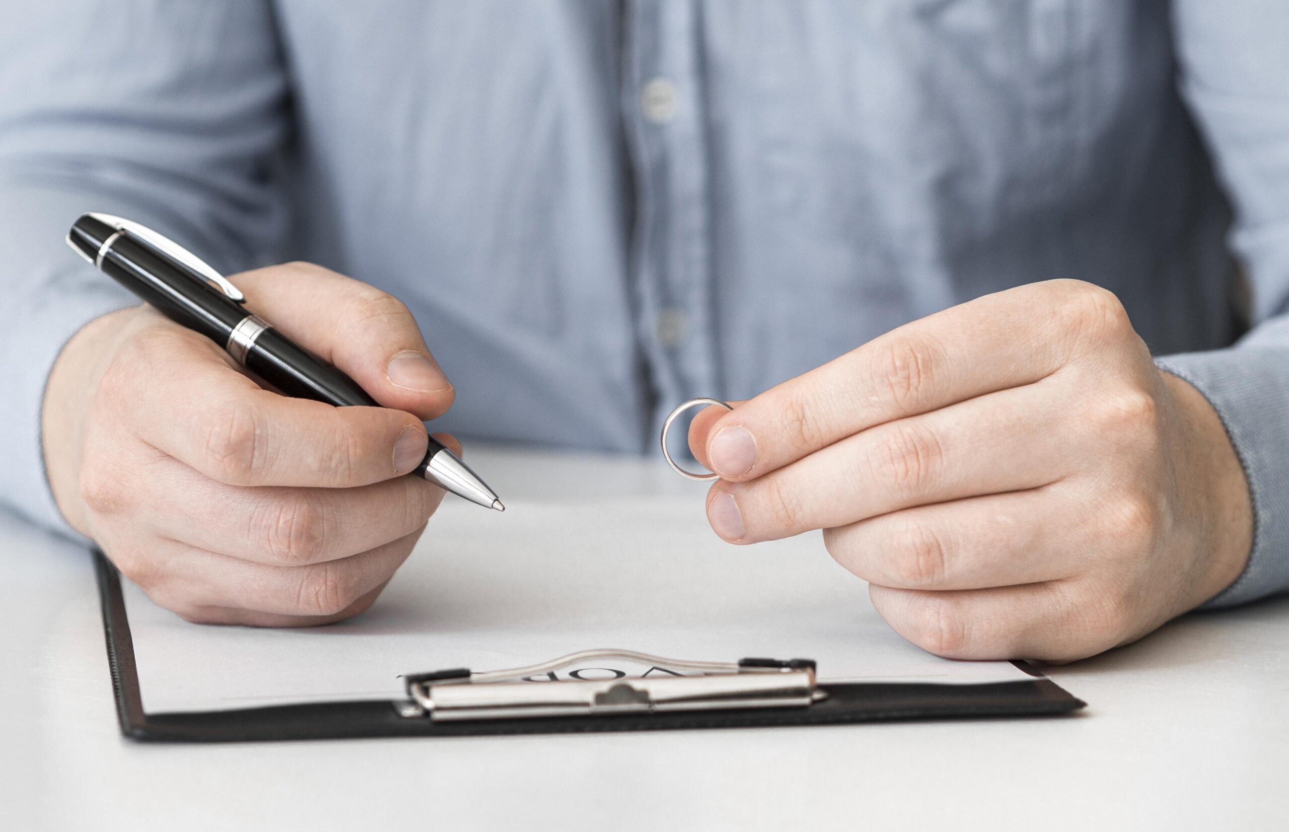close-up-man-prepared-sign-divorce-contract