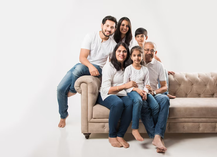 indian-asian-family-sitting-sofa-couch-white-background_466689-31831