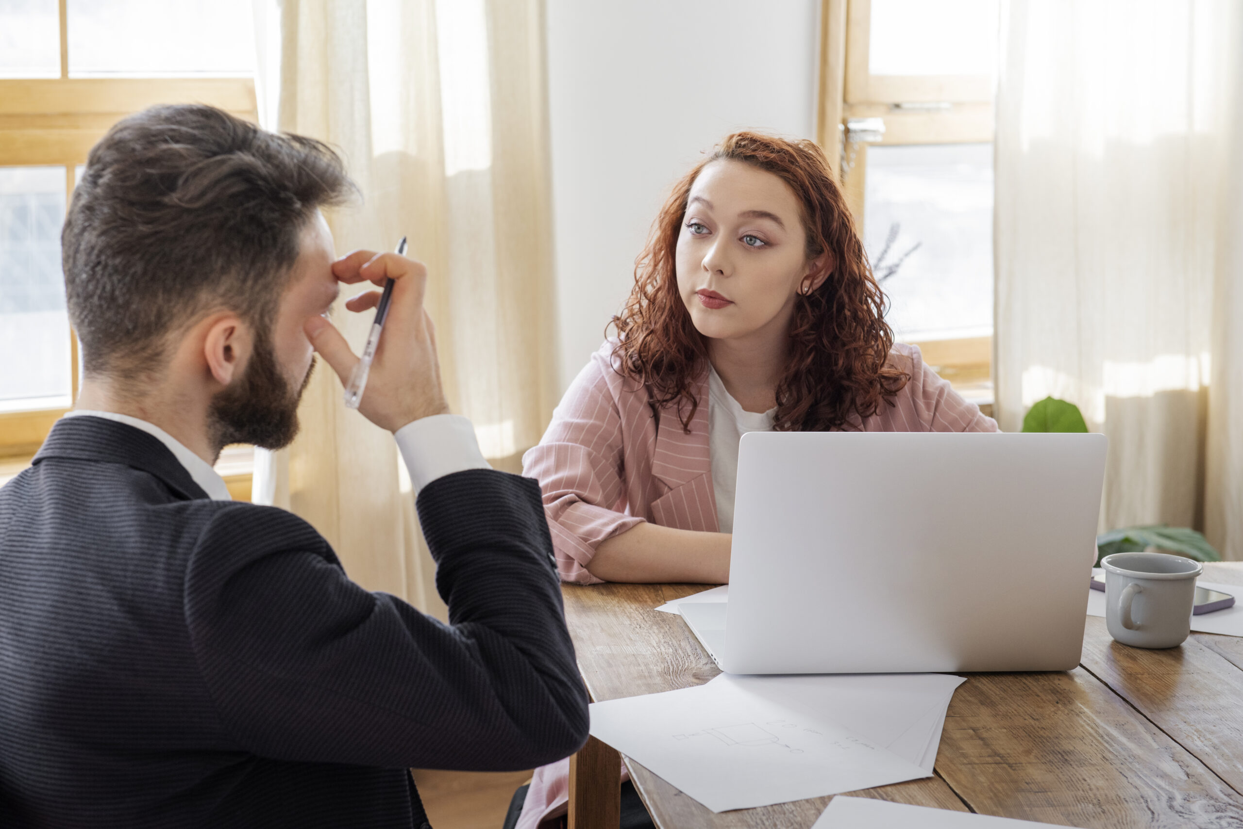 people-having-debate-while-looking-computer