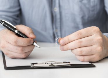 close-up-man-prepared-sign-divorce-contract