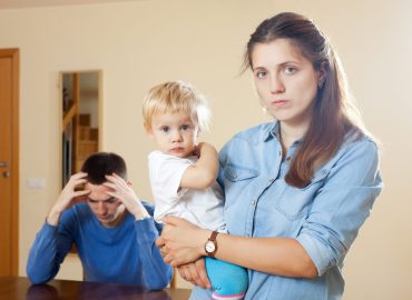 Family of three with child having conflict