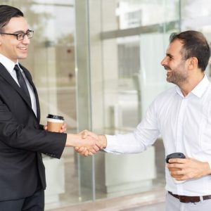 portrait-happy-male-business-partners-shaking-hands_1262-15050