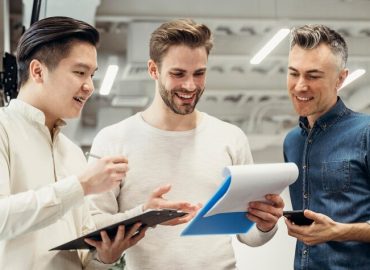 smiley-men-discussing-about-project-work_23-2148746305